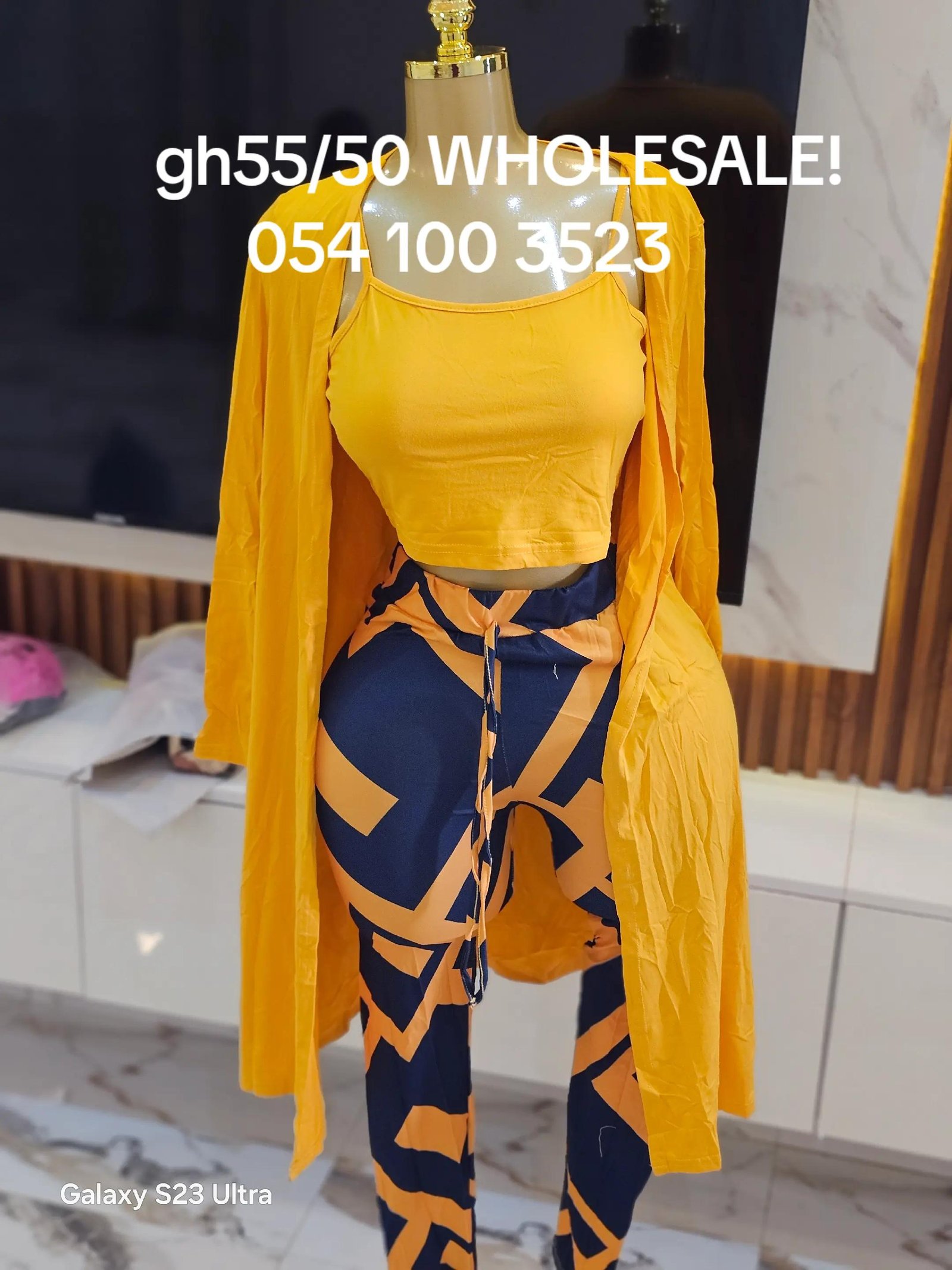 Horizon Geometric 3-Piece Coord Set - Mustard yellow cropped camisole with thin spaghetti straps, high-waist joggers with navy and mustard abstract geometric pattern, and matching floor-length open-front duster cardigan